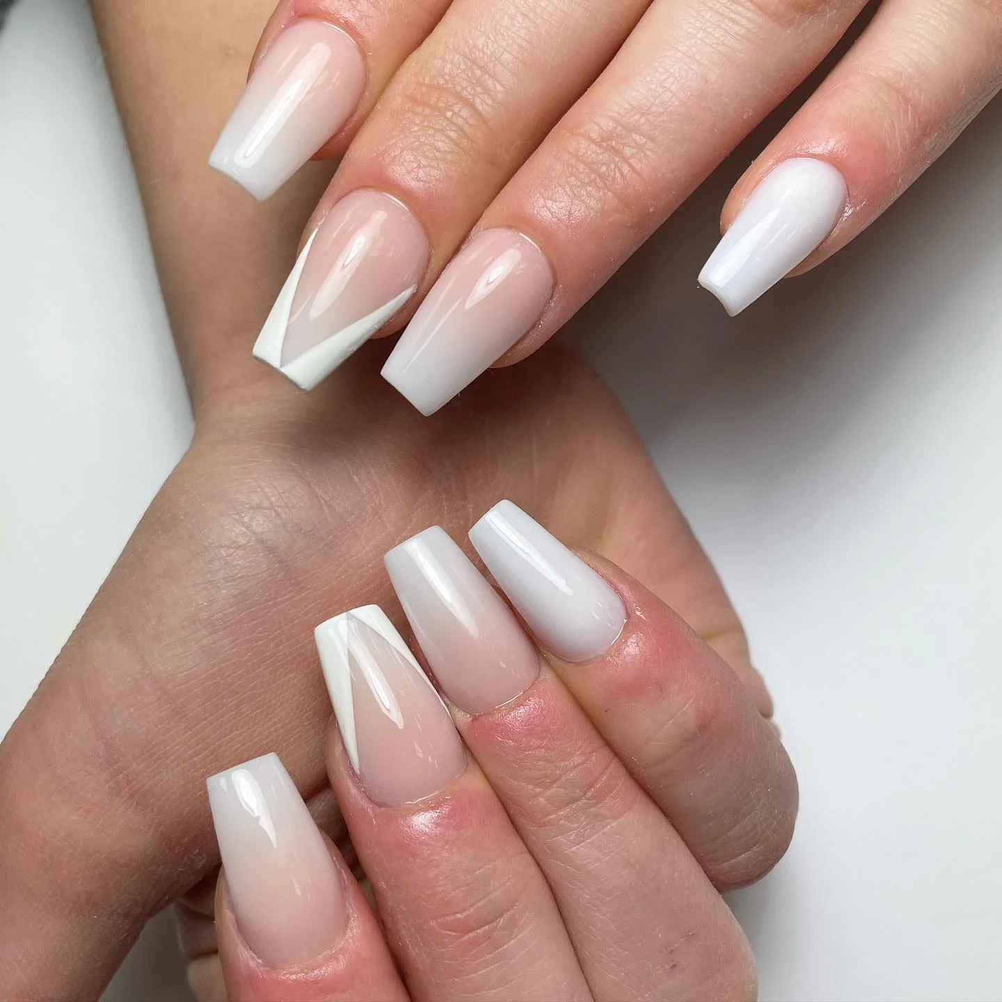 Milky nude manicure with crisp white French tips