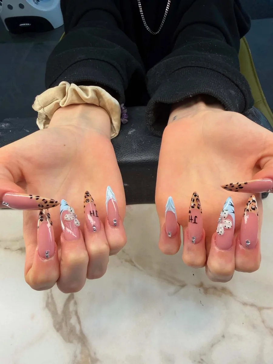 Long pink illustrated nail art